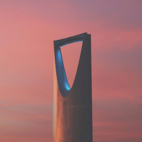Kingdom Tower in Riyadh against a pink sky